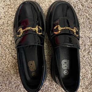 Black Patent Leather Loafers with Gold Accent